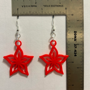 Plumeria earrings with layered petals and vibrant tropical colors.