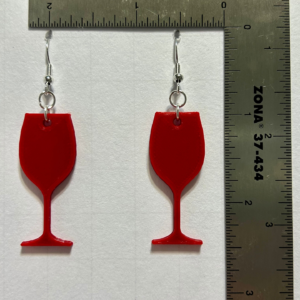 Wine glass earrings with detailed beverage design.