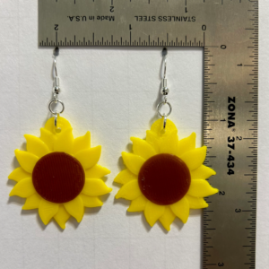 Sunflower earrings with vibrant yellow petals and detailed center.