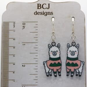 llama earrings wearing colorful ugly Christmas sweaters