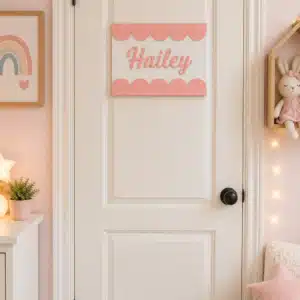 Personalized Scalloped Name Sign featuring a custom child name in raised script lettering with a decorative scalloped border for nursery or bedroom décor.