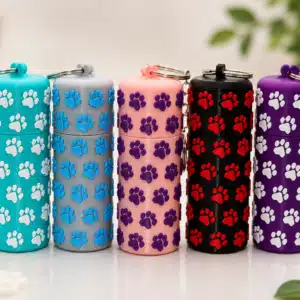 Five colorful Paw Print Chapstick Holder Keychains featuring raised contrasting paw prints and metal keyrings.